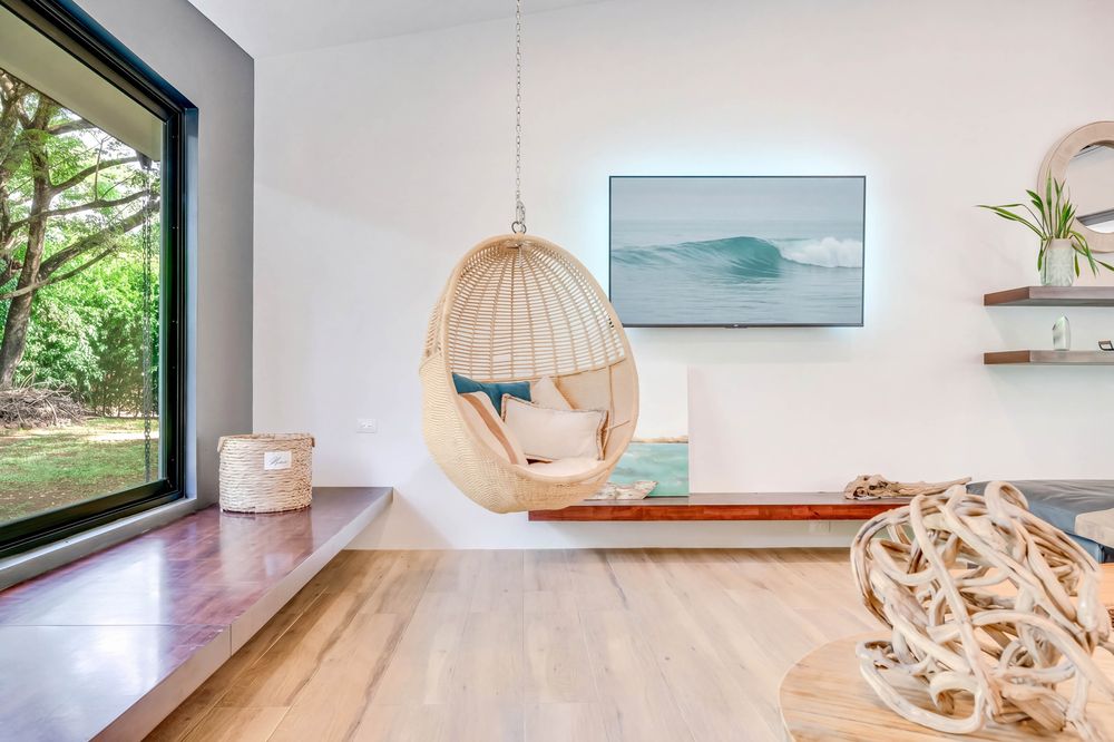 Rattan hanging chair by the window