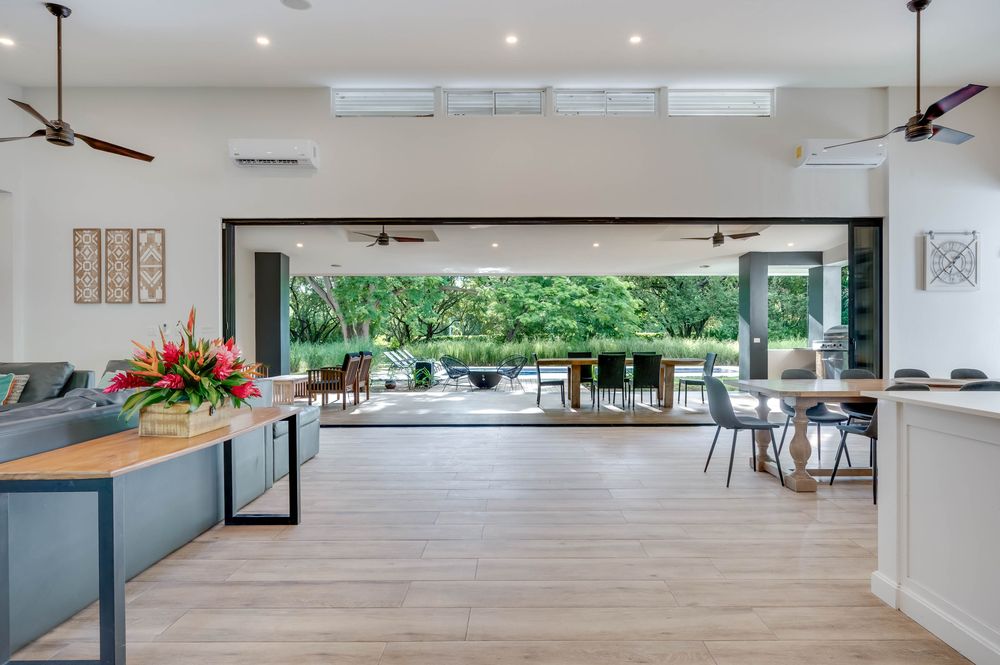 The great room at Casa Poiema fully open to the pool deck